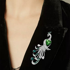 Elegant green brooch against cloth background