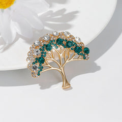 Close-up of a gold lucky tree brooch