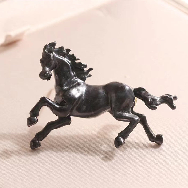 Close-up of vintage horse brooch design