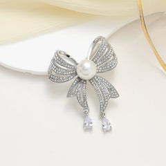 Elegant floral pin displaying intricate rhinestone work