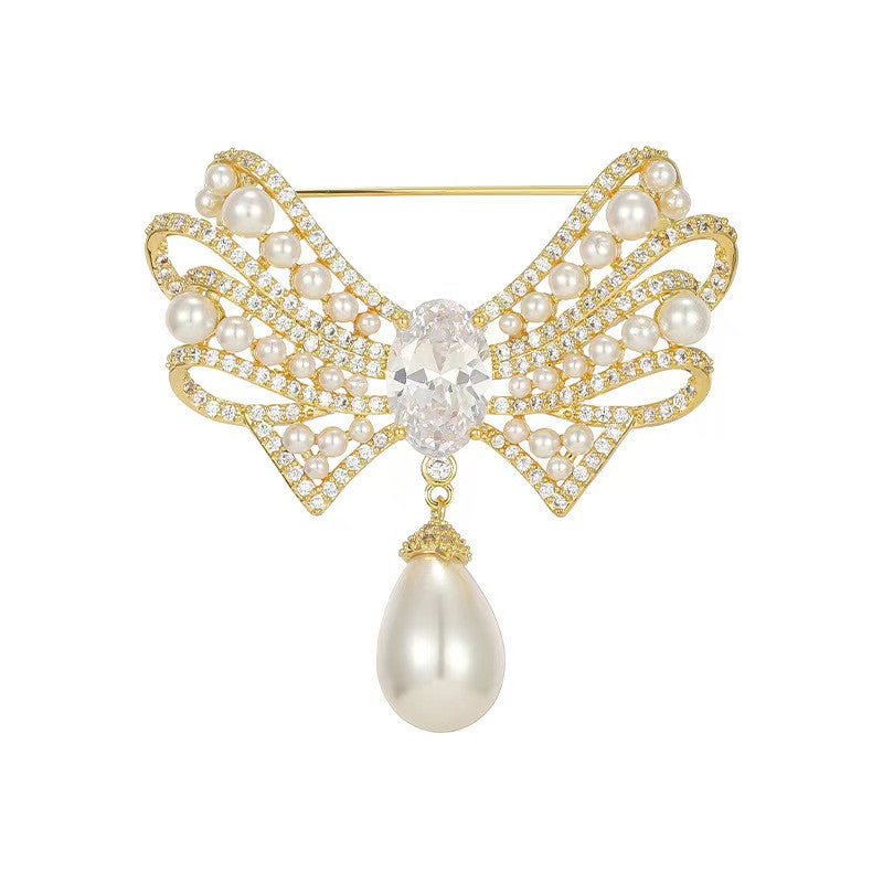 Gold brooch worn as a clothing accessory