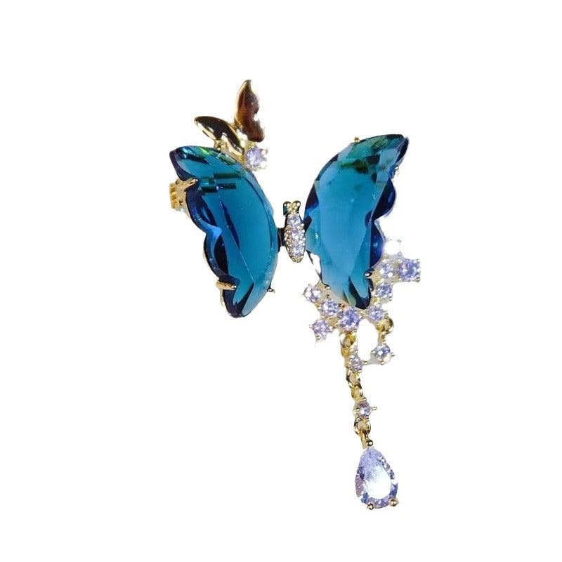 Detailed view of the tassels on the butterfly brooch