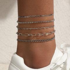 Anklet set laid out on a floral background