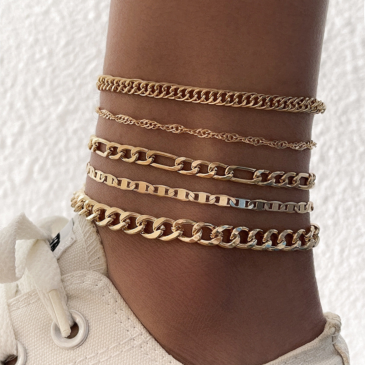 Showing the shine and texture of the metal anklet