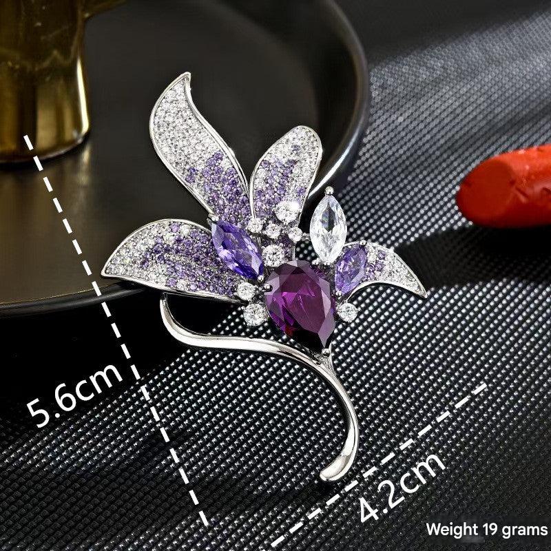 Elegant Purple Lily Flower Brooch displayed on a dress