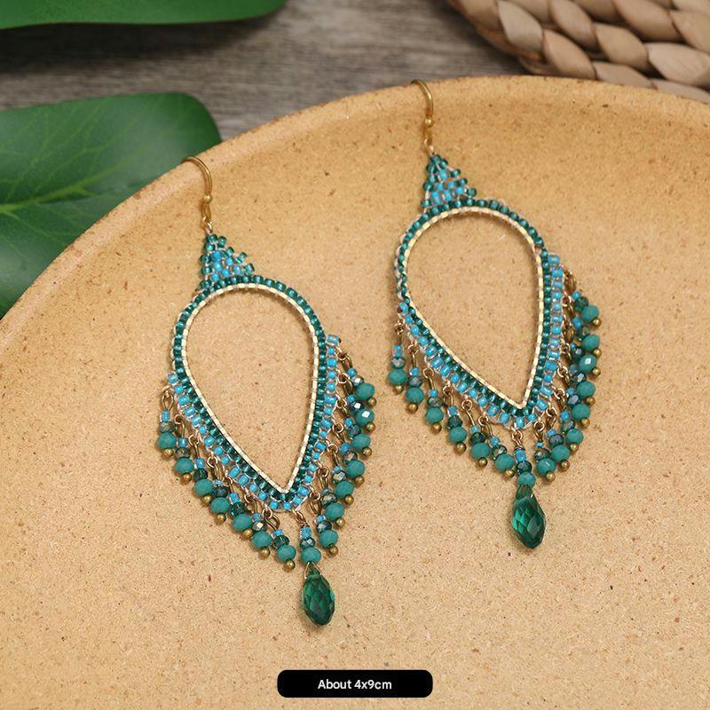 Artistic handmade earrings on velvet