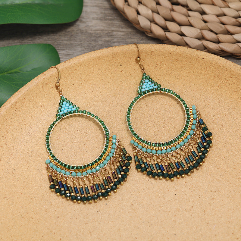 Handmade bohemian tassel earrings on display