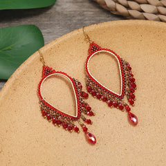 Close-up of vintage chic long tassel earrings