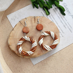 Close-up of Rattan Earrings on display