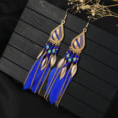 Closeup of stylish blue tassel earrings