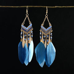 Closeup of stylish blue tassel earrings
