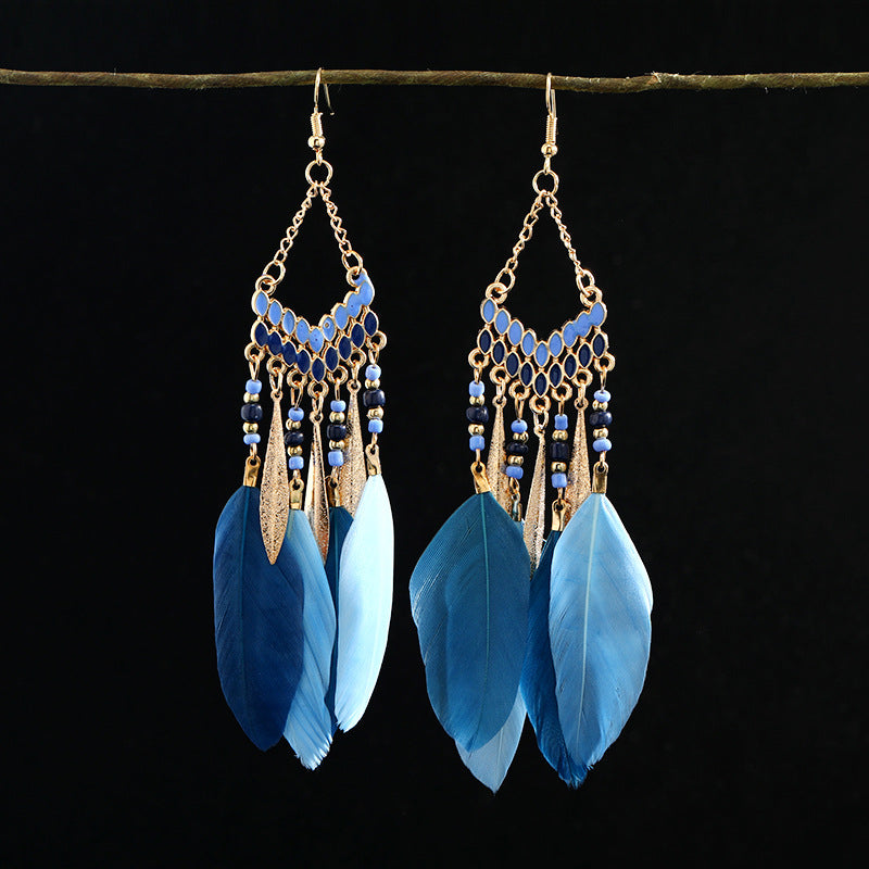 Closeup of stylish blue tassel earrings