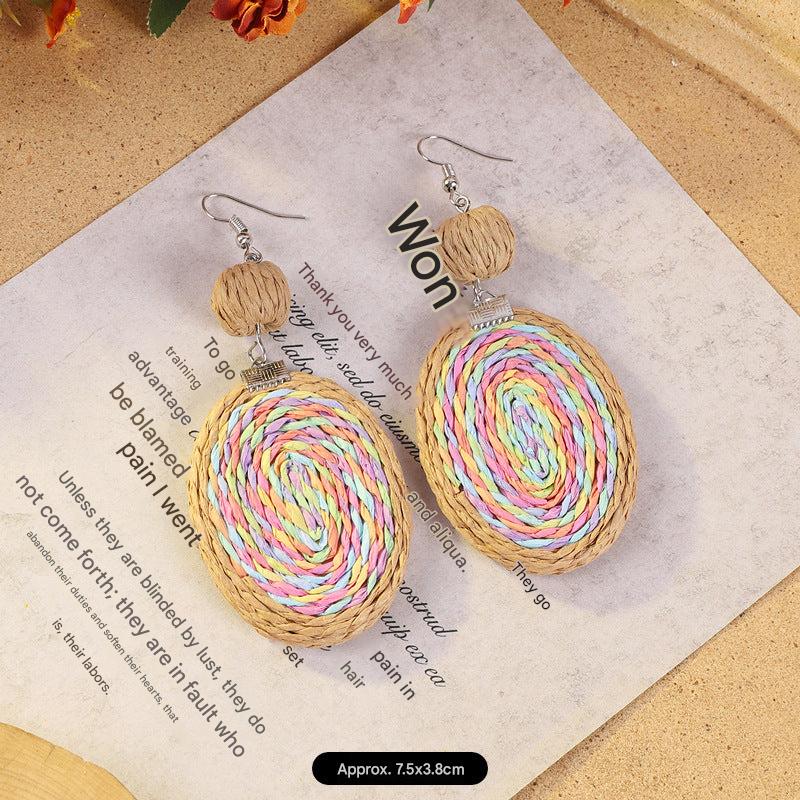 Elegant woven rattan earrings on display