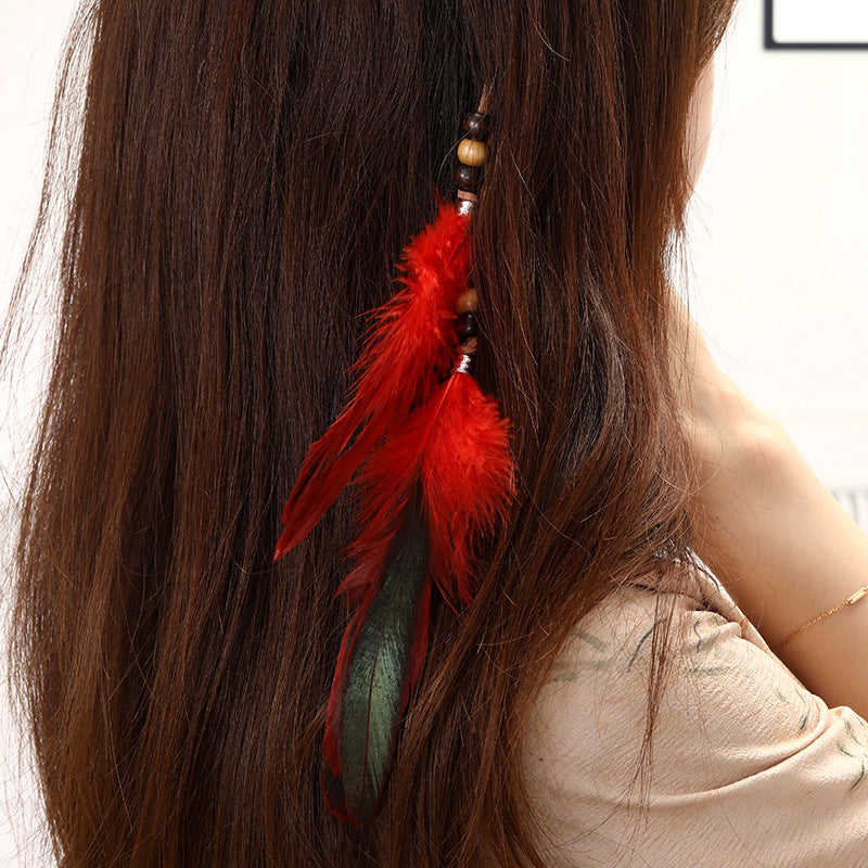 Handmade feather hair accessory with chic tassels