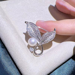 Stylish brooch worn on a dress showcasing its elegance