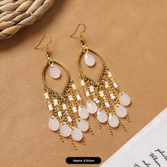 handcrafted feather earrings with long tassels
