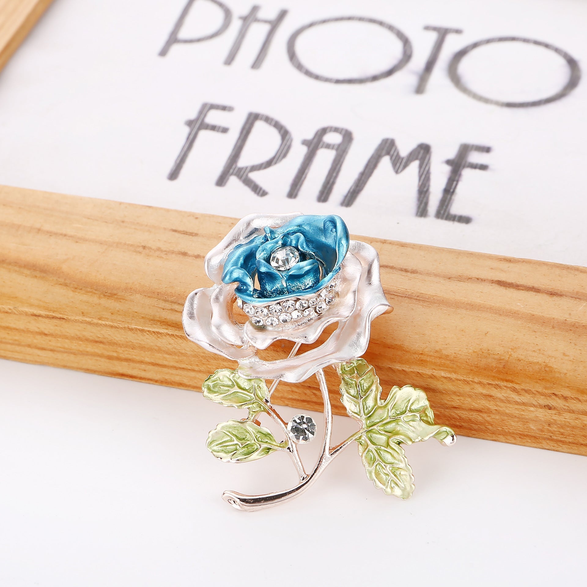 Detailed view of rhinestone accents on brooch