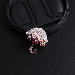 Rhinestone brooch on a scarf display