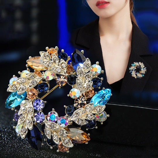 Stylish floral brooch on a scarf