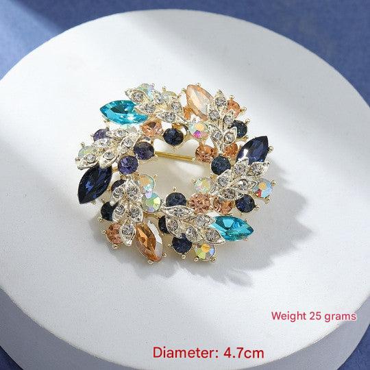 Close-up of a floral accessory brooch in green