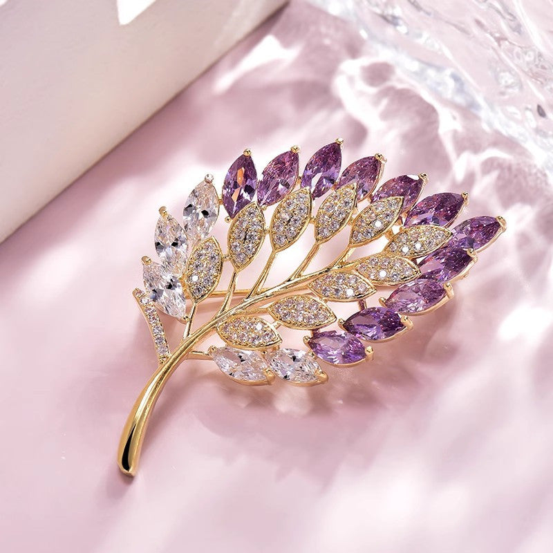 Elegant maple leaf design brooch on fabric