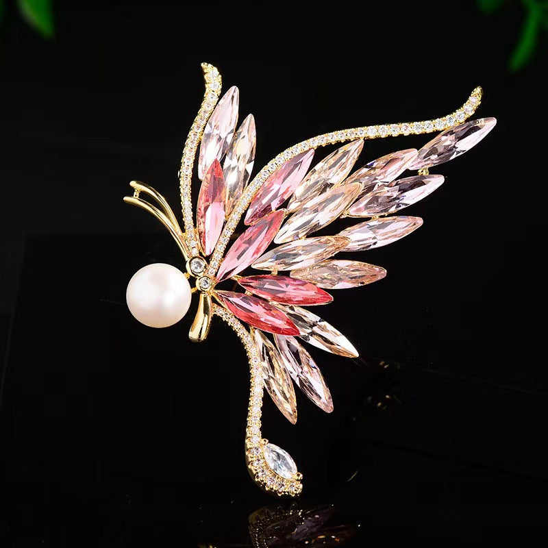 Elegant blue and pink butterfly brooch close up
