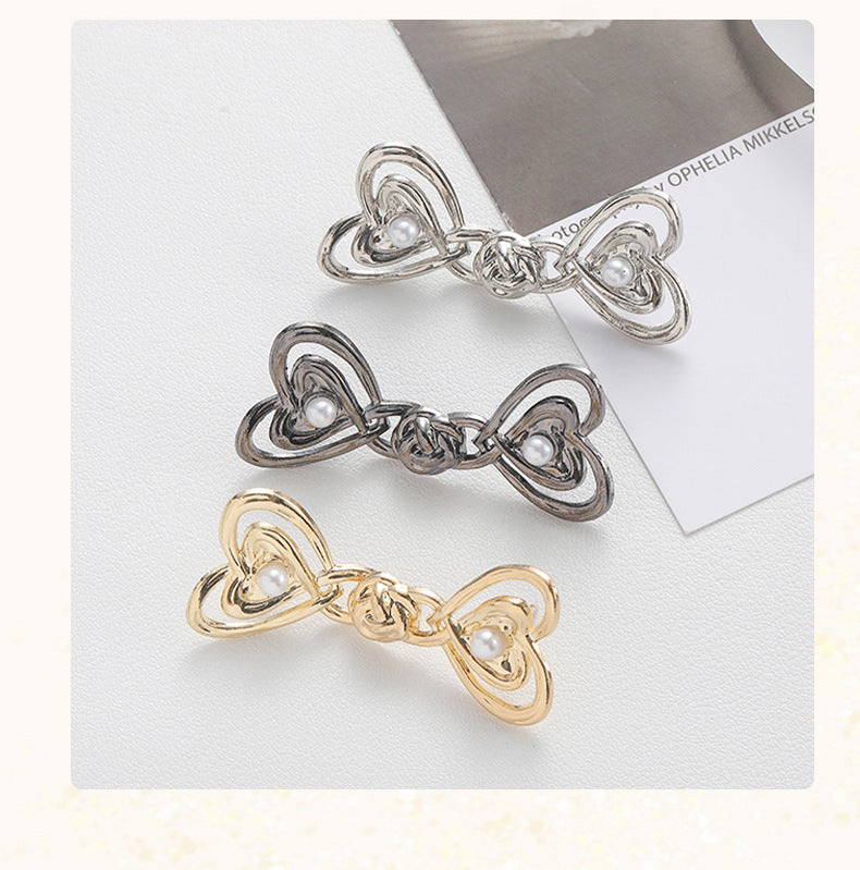 Close-up of metal waist button for custom sizing