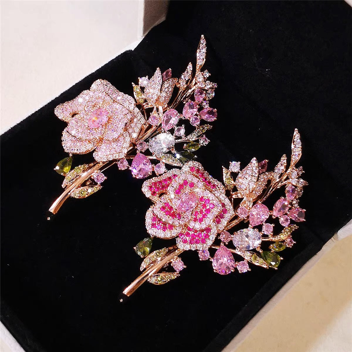 Different angles of the floral brooch design