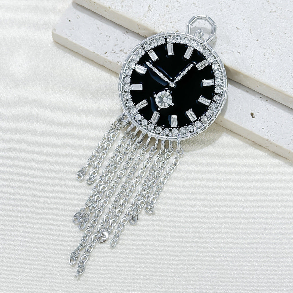 Fashion pin brooch displayed on fabric