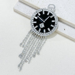 Fashion pin brooch displayed on fabric