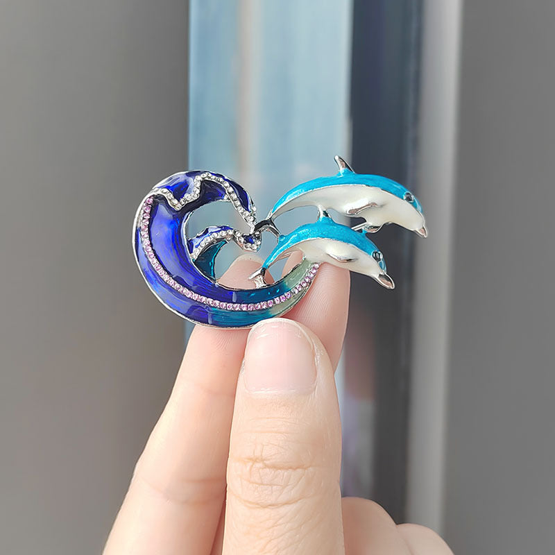 Dolphin Brooch displayed on a white background