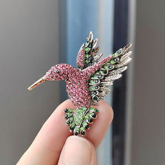 Fashionable women wearing a hummingbird brooch