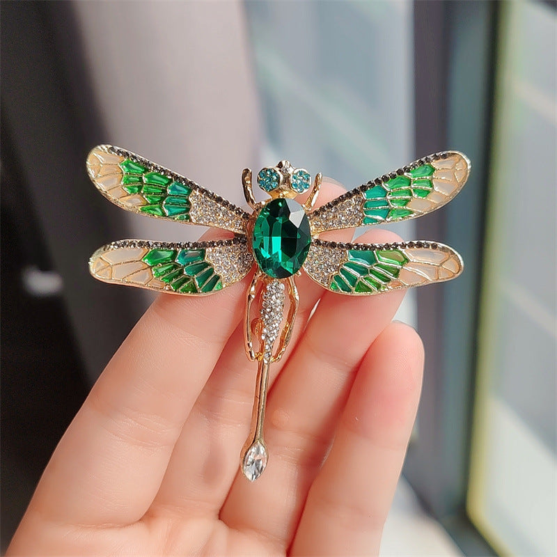 Unisex dragonfly accessory on a coat