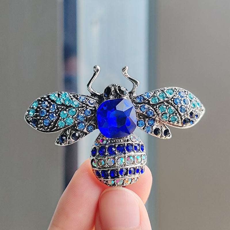 Close-up detail of the bee brooch