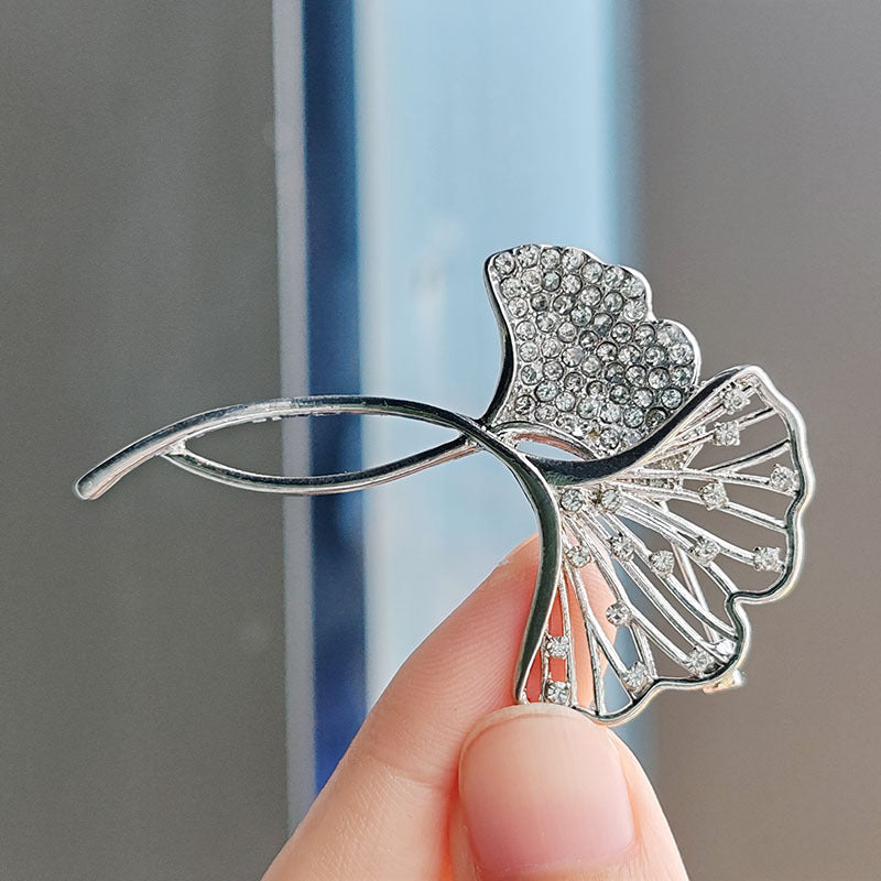 Elegant brooch showcased on black jacket image 6
