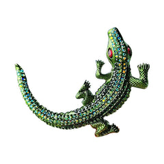Flat lay photography of the crocodile brooch