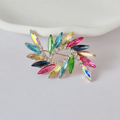 Crystal floral pin on scarf