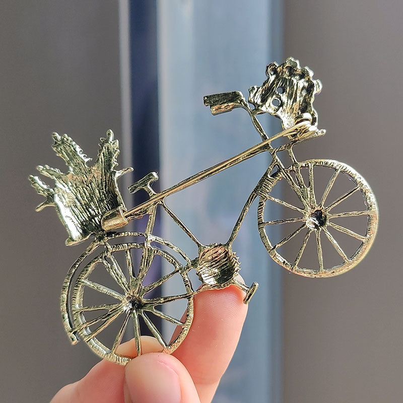Rhinestone bicycle brooch on a fashionably dressed model