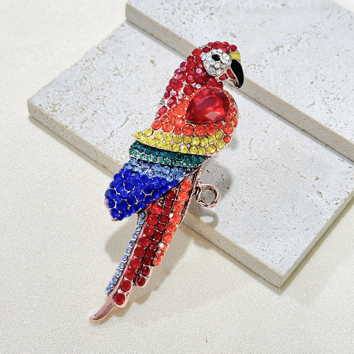 Stylish woman wearing a parrot brooch on her jacket