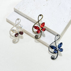 Close-up of crystal details on the butterfly brooch