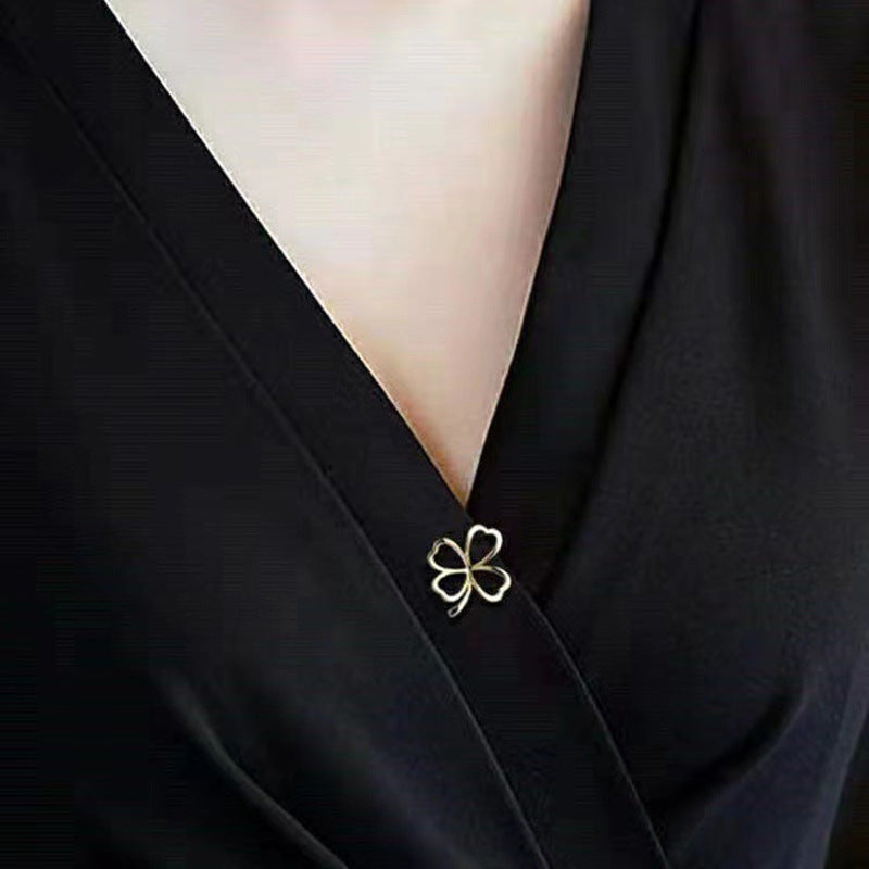 Wearing the Clover brooch on a jacket