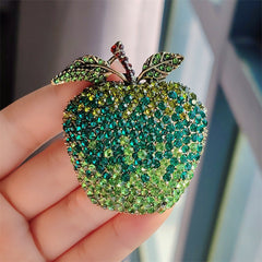 Close-up of rhinestone embellished vintage fruit brooch