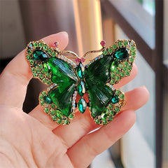 Close-up of butterfly brooch in vibrant green