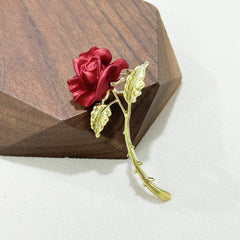 elegant red rose brooch displayed elegantly