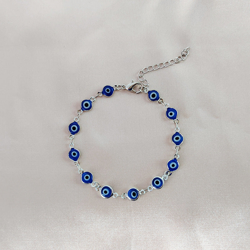 Turquoise Blue Evil Eye Bracelet on Table