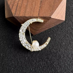 silver moon brooch showcasing elegance
