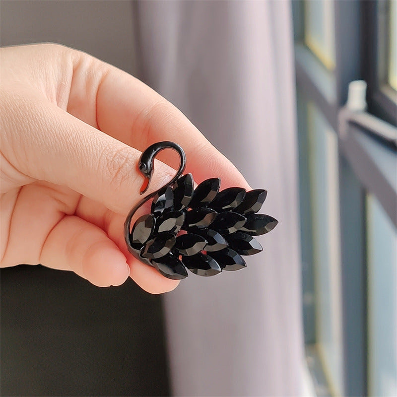 Close-up view of the crystal finish brooch - Image 3