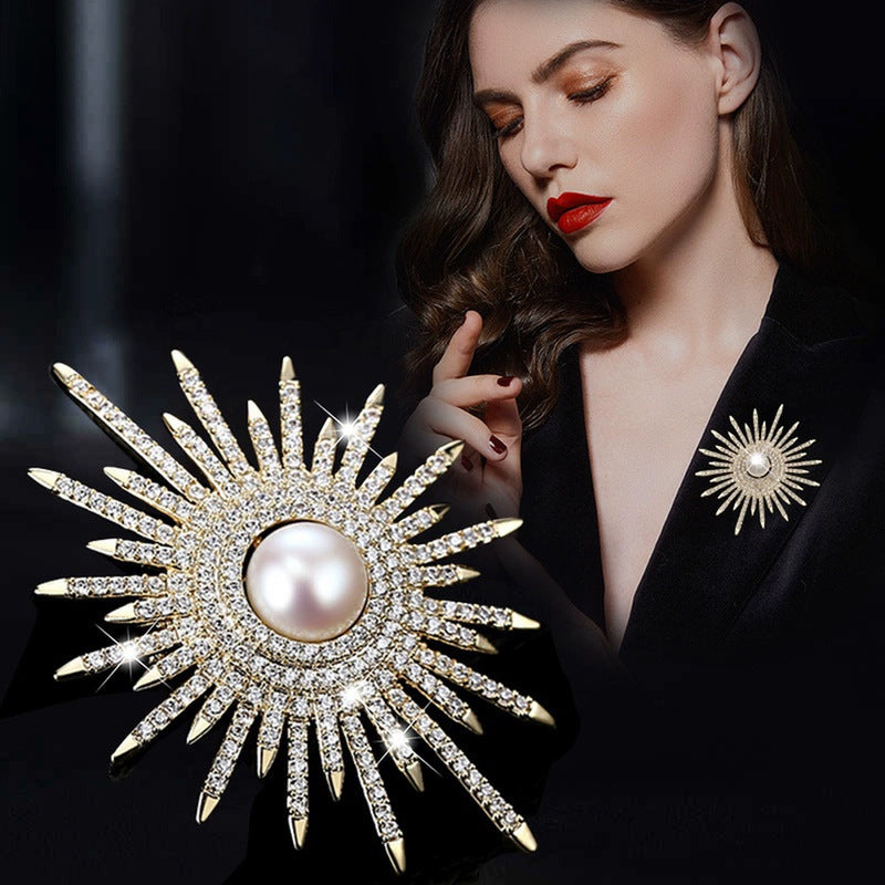 Close-up of sunflower brooch detailing with pearls