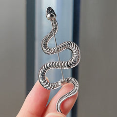 Close-up of silver snake pin