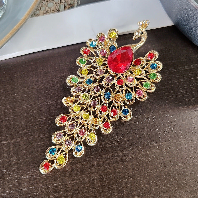 Stylish peacock brooch on a coat